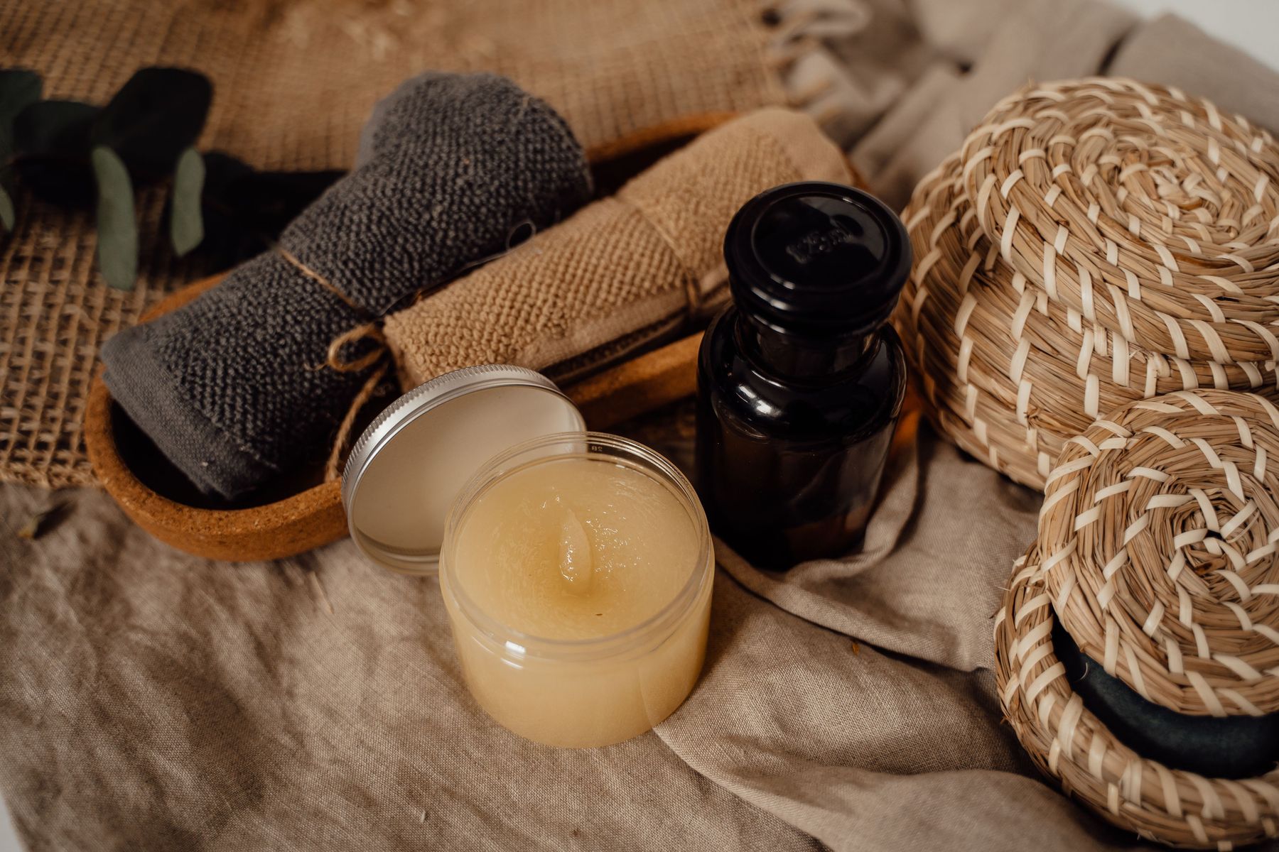 Hand-rolled towels, balms and woven baskets prepared for treatments