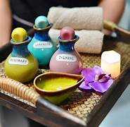 Warm aromatic oil for Thai oil massage at Thai Healing Hands